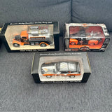 Orange and black diecast vehicle set in three retail display boxes