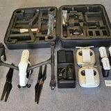 Drone bundle in hard case with controller, batteries, and accessories