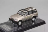 1/64 scale diecast SUV model car, gold and black, on display base