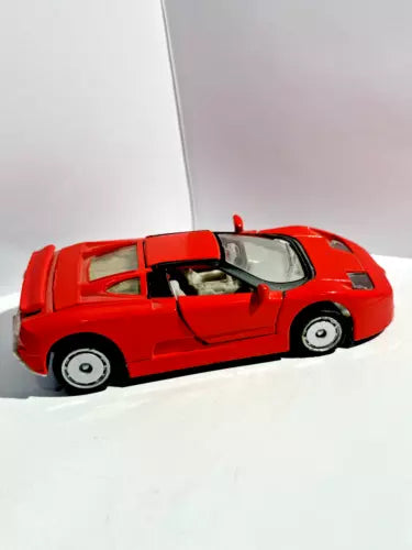 Red 1/36 scale diecast toy car with open door, detailed wheels and windows