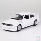White 1/36 scale alloy diecast toy model car, BMW M3 1987, front 3/4 view