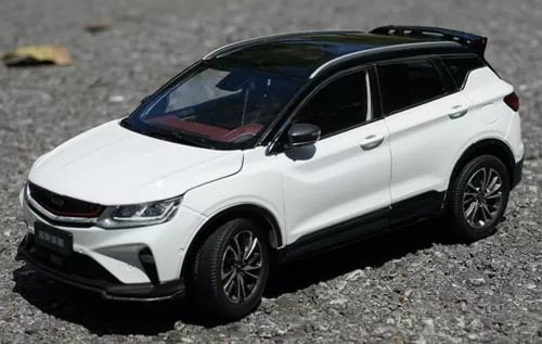 White diecast SUV car model with black wheels and tinted windows