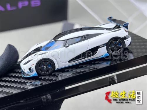 1:64 white and blue sports diecast car with black wheels, front 3/4 view