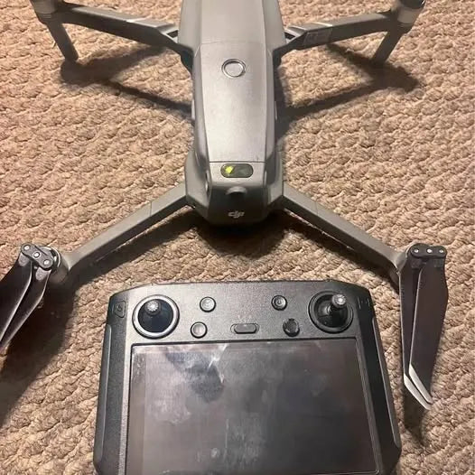Humble TX drone with propeller arms and controller screen, front view