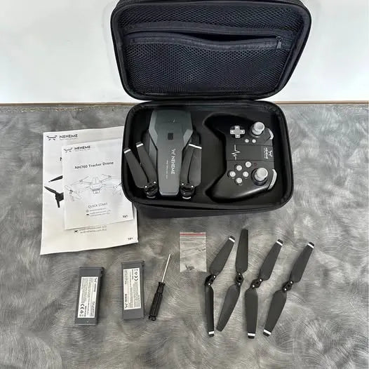 Drone remote controller kit in zip case, with manuals, batteries, and spare propellers