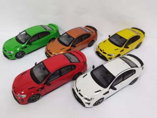 Multi-color sports car diecast models, five vehicles shown in green, orange, yellow, red, white.