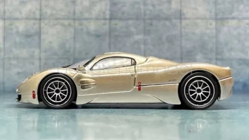 1:64 scale gold sports car diecast model with metal parts
