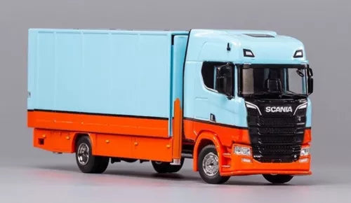 Blue and orange enclosed tow truck model with black grille, front 3/4 view, diecast