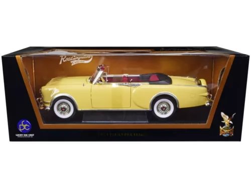 Yellow 1953 Packard Caribbean convertible diecast model car in display box