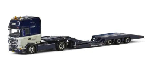 Diecast truck transporter model with dark blue cab and black flatbed trailer chassis