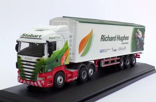 Diecast Scania truck model with white trailer, green cab, red trim and Richard Hughes branding