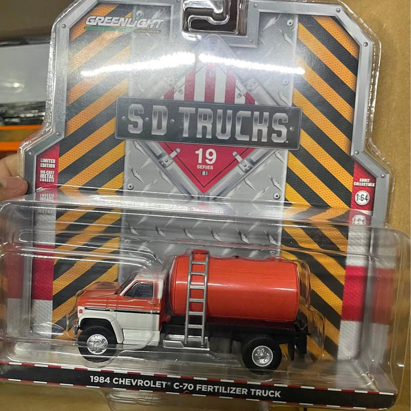 1/64 scale diecast tanker truck, white cab with red tanker and front ladder