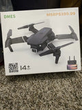 Black quadcopter drone with controller, shown on retail box
