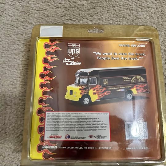 UPS racing flame diecast truck in blister packaging, yellow and black truck detail