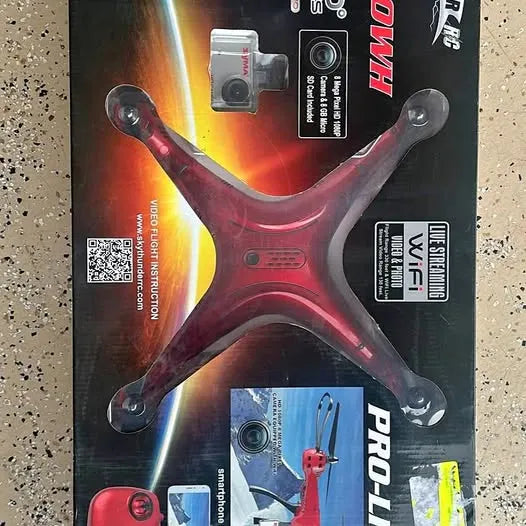 Racing drone with four propeller arms and visible camera module on retail packaging