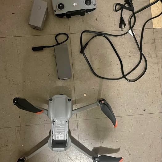 DJI Air 2S drone with four propellers and front camera pod, light gray body