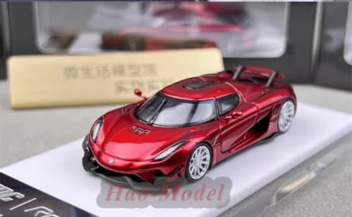 Red alloy diecast Koenigsegg Regera model car with silver windows, detailed body