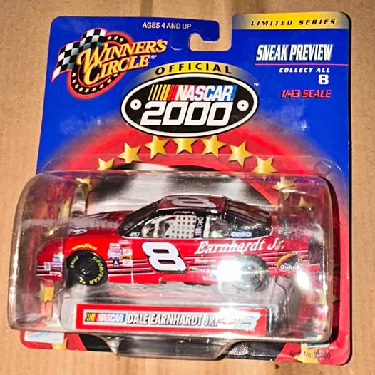 Red NASCAR diecast stock car with number 8, in blister packaging