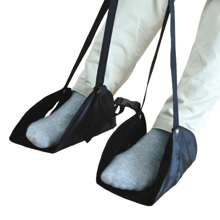 Portable under-desk footrest with two cushioned gray pads and black carrying straps