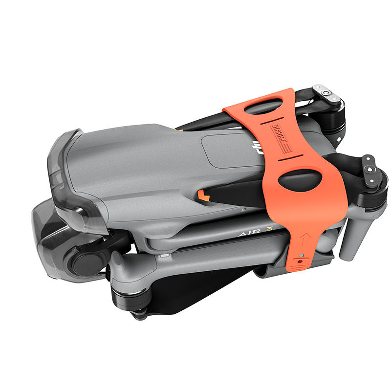 Drone propeller holder quick-release accessory with orange handle and gray frame