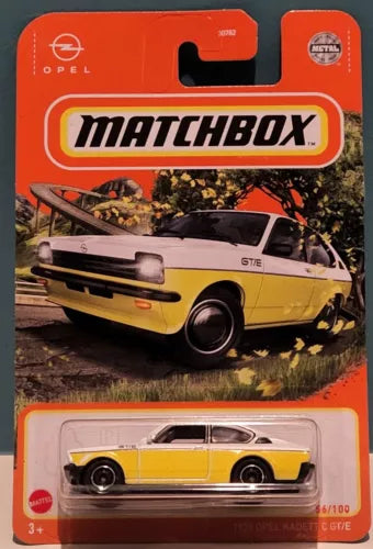 Yellow and black diecast Opel Kadett GT/E car in blister package