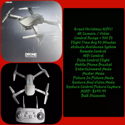 White quadcopter drone with four propellers and handheld remote controller