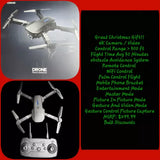 White quadcopter drone with four propellers and handheld remote controller