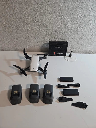 DJI Spark drone parts and accessories, including batteries, body shells, and propellers