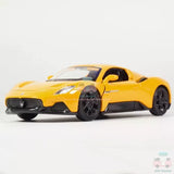 Yellow diecast model car with black wheels, front three-quarter view