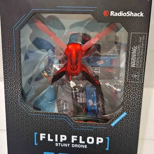 Red stunt drone with folded propellers in retail box