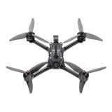 Racing FPV quadcopter drone with four gray propellers and central controller frame