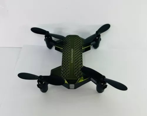 Compact folding micro drone with four propellers in dark green