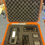Holy Stone HS720g drone parts in open orange hard case, controller and cables visible