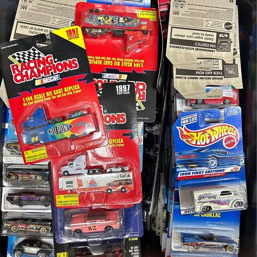Collectible diecast cars in blister packs, with Racing Champions and Hot Wheels toy cars