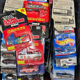Collectible diecast cars in blister packs, with Racing Champions and Hot Wheels toy cars