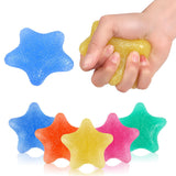Gel finger grip training star, yellow star held in hand with blue, orange, pink, and green stars