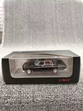 Black diecast sedan model in clear display case with ENIF logo