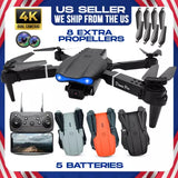 RC quadcopter drone with front camera and four propeller arms; extra propellers included