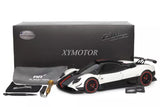 White and black 1/18 diecast model car with display parts, in presentation box