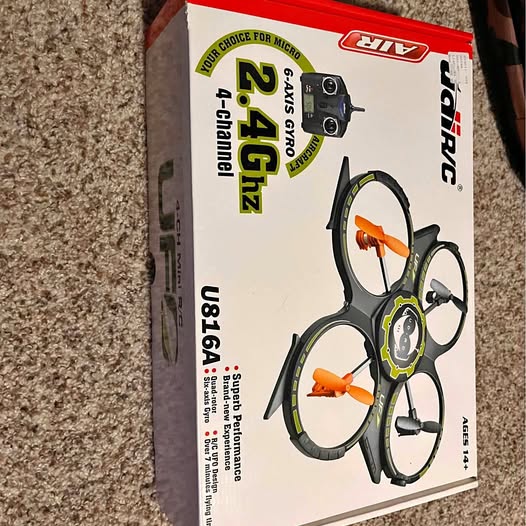 UFO drone retail box with three-propeller quad design illustration