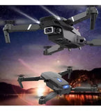 Gray foldable quadcopter drone with 4K camera and blue LED lights