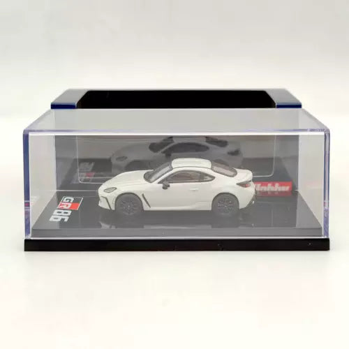 White Toyota GR86 diecast model car in clear display case