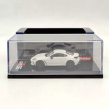 White Toyota GR86 diecast model car in clear display case