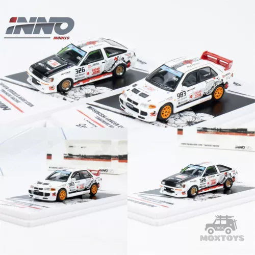 Diecast model car toy set with two white rally cars, orange wheels, and red car bed
