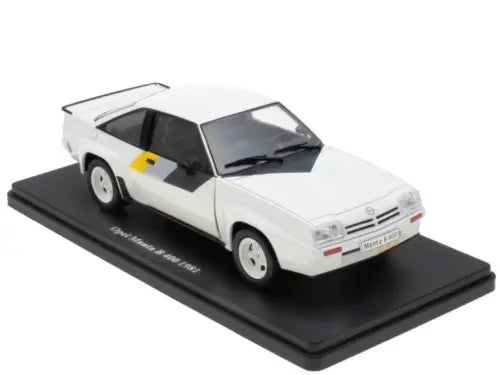 White 1/24 scale diecast car model with open hood and black side panels
