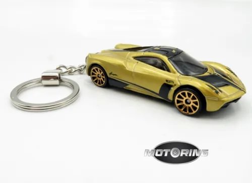 Gold and black diecast car keychain with attached metal key ring and chain