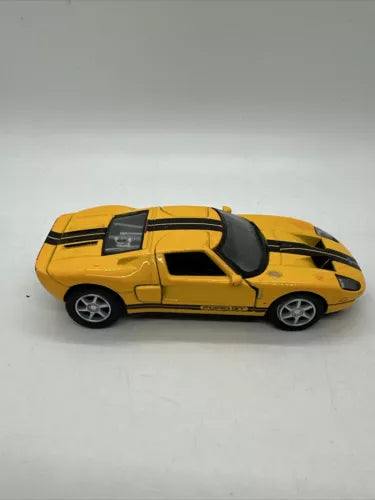 Yellow sports diecast car model with black stripes, side view, pull-back toy 1:36