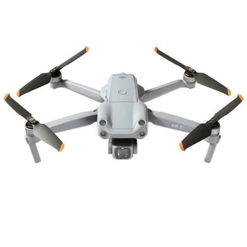 DJI gray quadcopter drone with four propellers and front camera gimbal