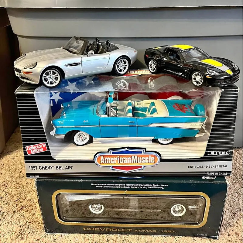 Diecast car set with blue and white convertible and black sports car, in retail box