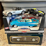 Diecast car set with blue and white convertible and black sports car, in retail box